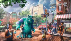 Nessa imagem ilustrativa de como será a nova área dos Monstros S.A. no parque temático Hollywood Studios em Walt Disney World Resort, temos em evidência Sulley com uma criança, um carro mosntruoso, um humano andando com um bebê monstro no lugar de um bebê humano, a cidade Monstrópolis ao fundo e a empresa onde Mike e Sulley trabalham